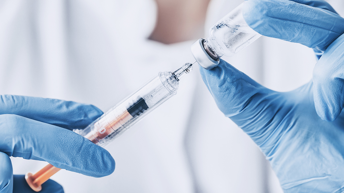 Syringe and vial of flu vaccine