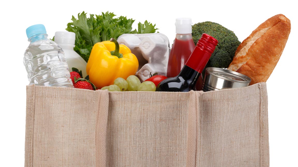 Reusable shopping bag full of groceries.