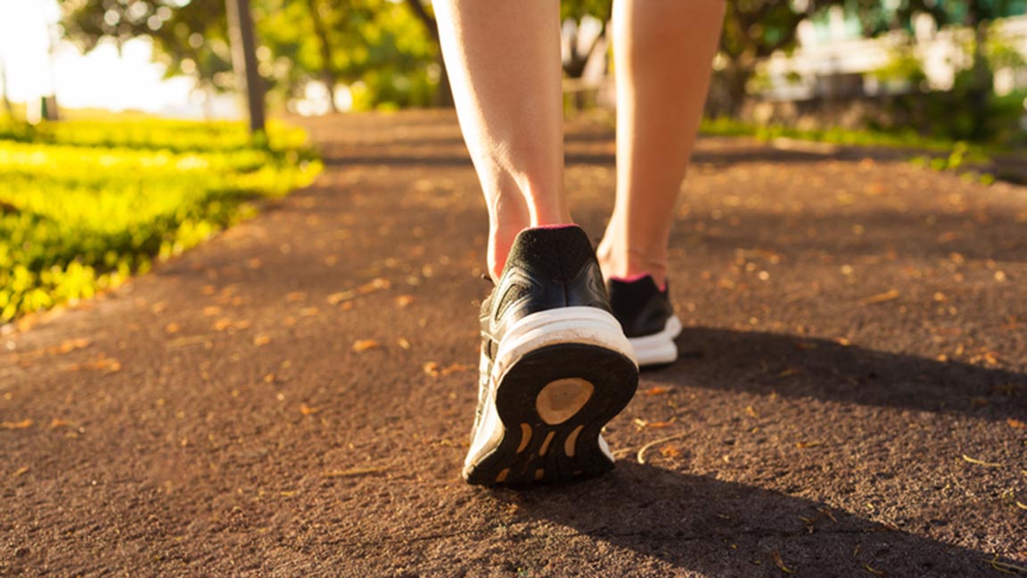 Woman walking on a path.