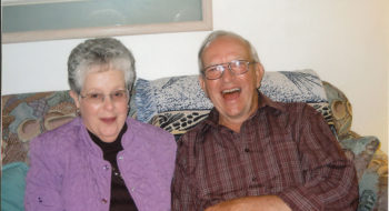 John Hughes shares a laugh with his wife, Doris.