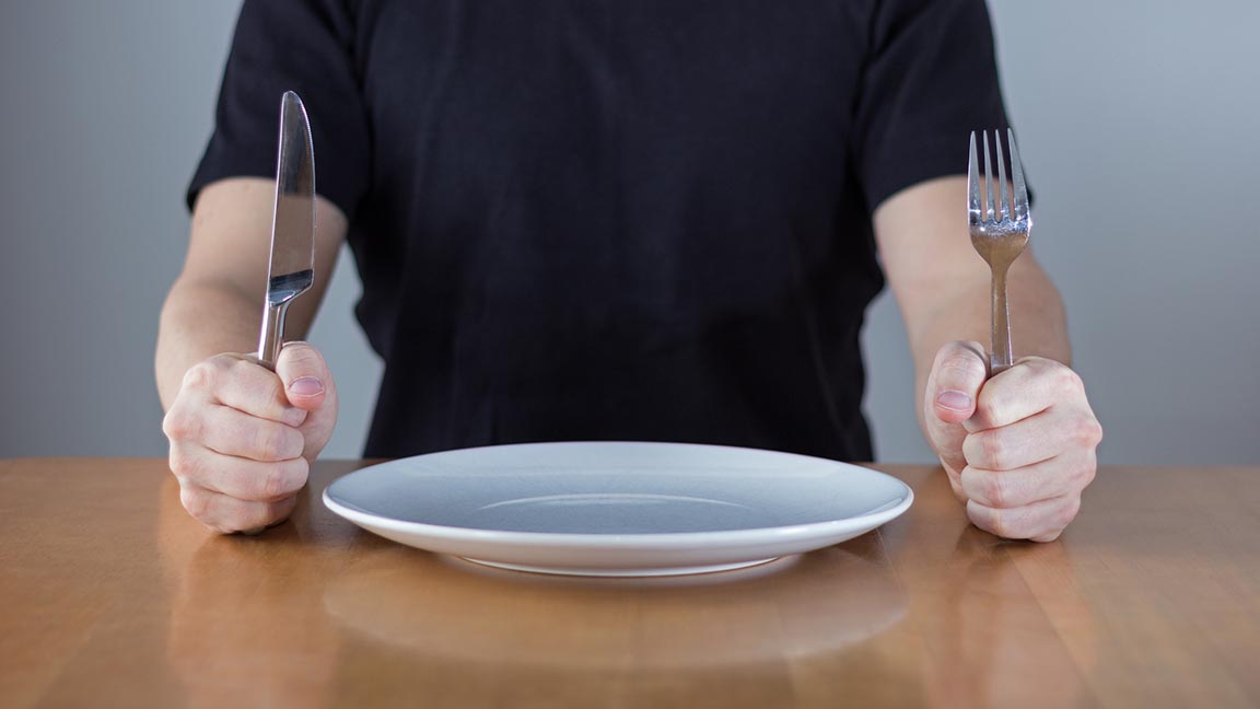 Man with empty plate