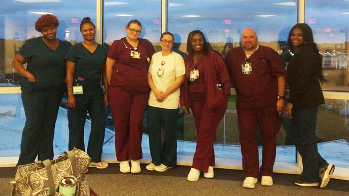 Members of the Tidelands Health and Carolinas Hospital System teams