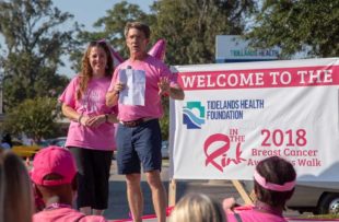 Tidelands Health breast surgeon Dr. Craig Brackett speaks to the crowd at the 2018 "In The Pink" Breast Cancer Awareness Walk