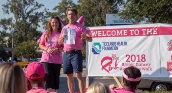 Tidelands Health breast surgeon Dr. Craig Brackett speaks to the crowd at the 2018 "In The Pink" Breast Cancer Awareness Walk