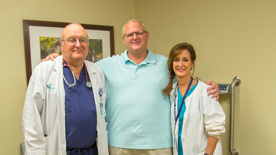 Hal James, center, smiles with Dr. Laurence Ballou, left, and Dana Waninger, a licensed practical nurse, at Tidelands Health Gastroenterology at Georgetown, where Hal was treated for colon cancer.