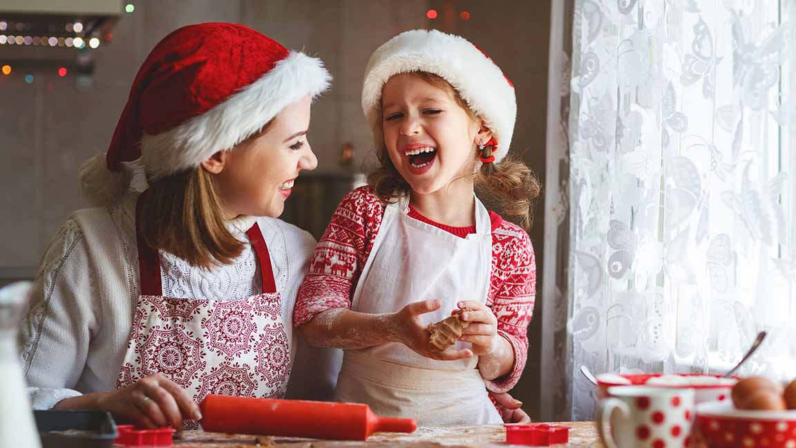 Mom and child bake cookies