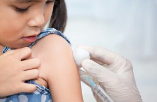 Child undergoing a vaccination.