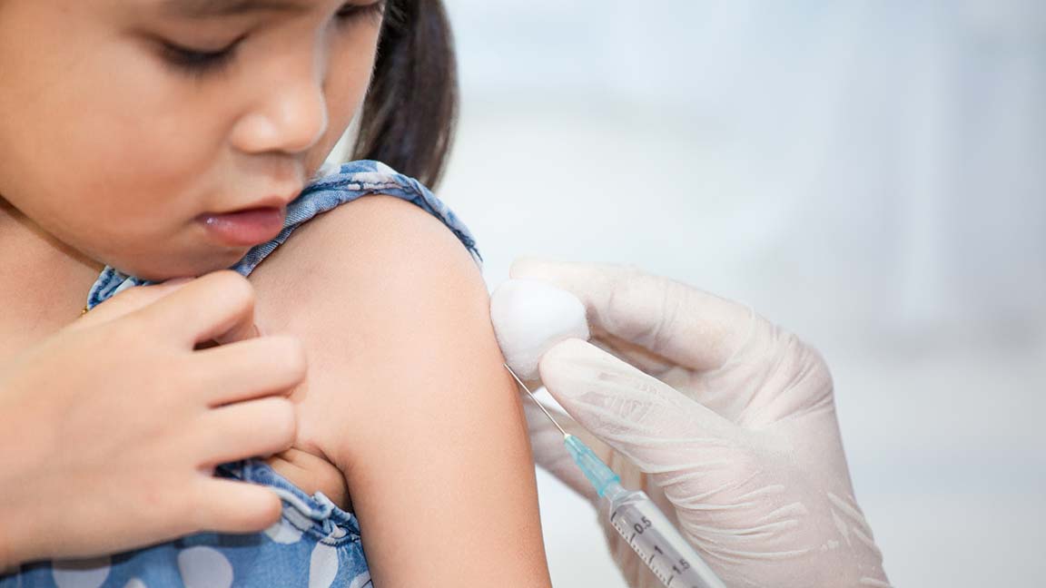Child undergoing a vaccination.