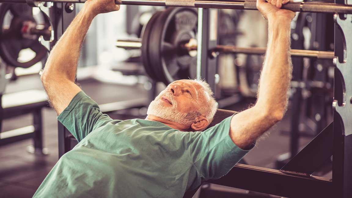 Senior lifting weights