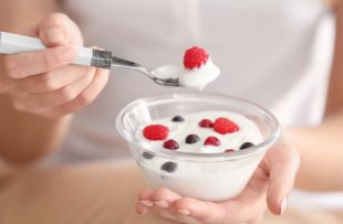 Woman eating yogurt