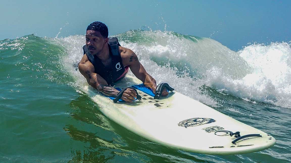 Ernie Johnson has overcome paralysis to become a champion surfer. Photo courtesy of David Vennell.