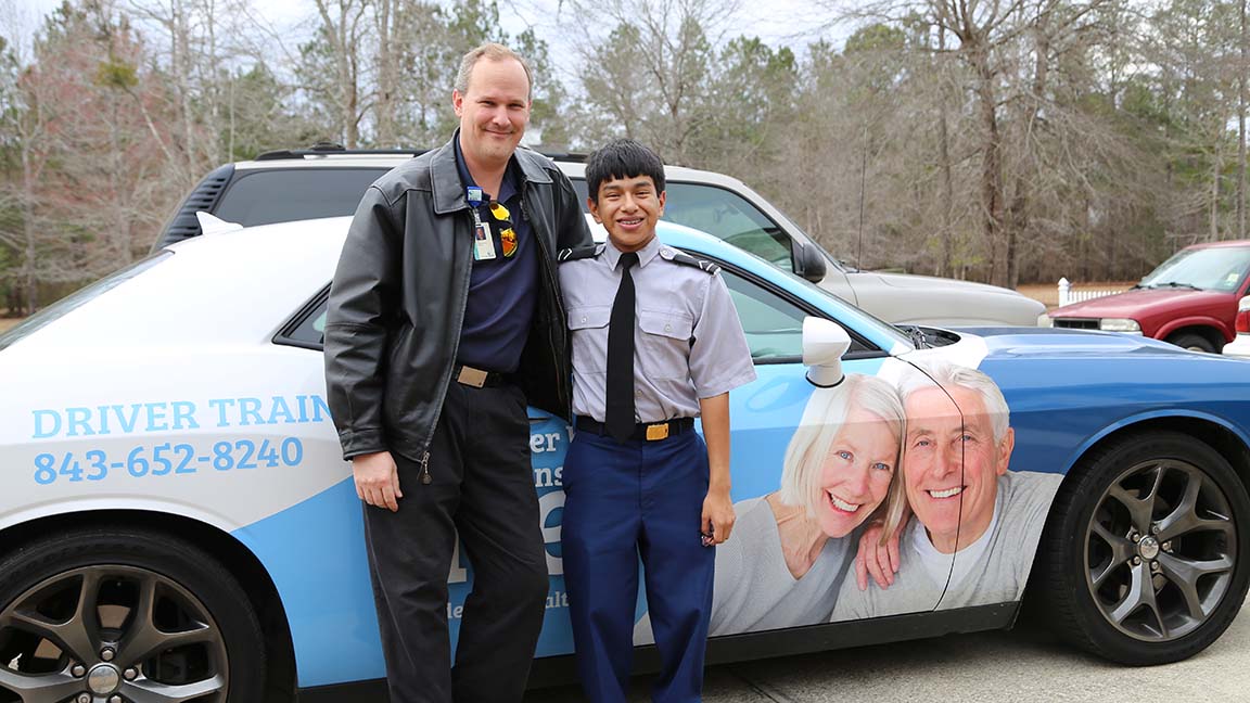 Jacob Bartlett, who has cerebral palsy, is among many people who has learned to drive in the 2015 Dodge Challenger used by the Tidelands Health driver rehabilitation program.
