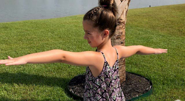 Addi is a big fan of yoga, one of the many ways she maintains and builds strength.