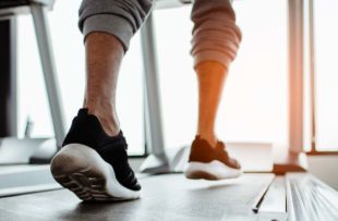 Close up on shoe,Man running in a gym on a treadmill.exercising concept.fitness and healthy lifestyle