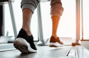 Close up on shoe,Man running in a gym on a treadmill.exercising concept.fitness and healthy lifestyle