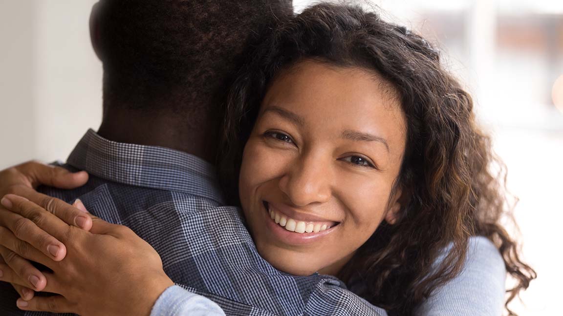 Woman embracing man