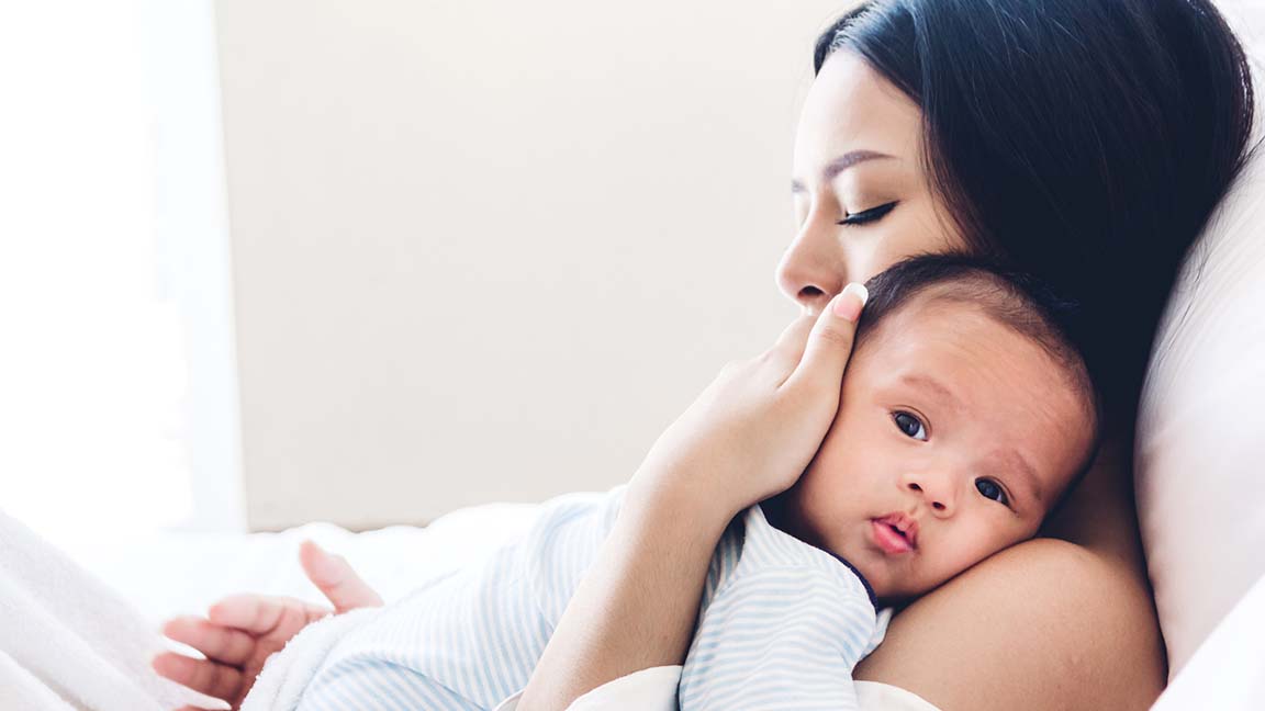 Mom holding child