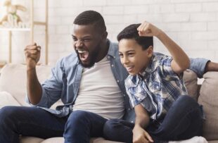 Father and son cheering