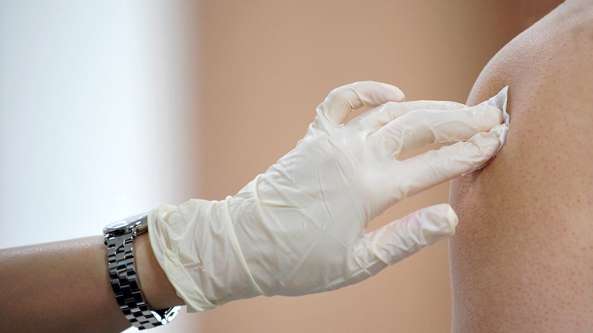 Patient receiving flu shot.