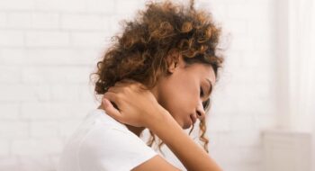 Woman struggling with neck crick.
