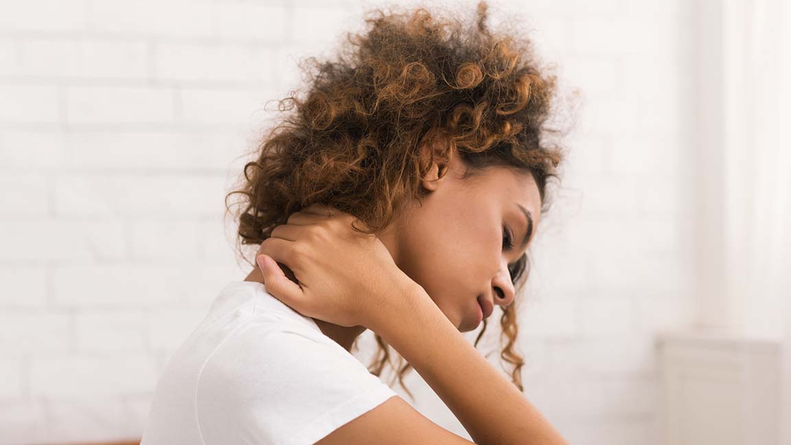 Woman struggling with neck crick.