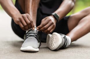 Man tying shoes