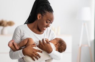 Woman breastfeeding baby.