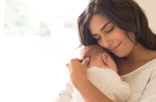 Woman holding newborn