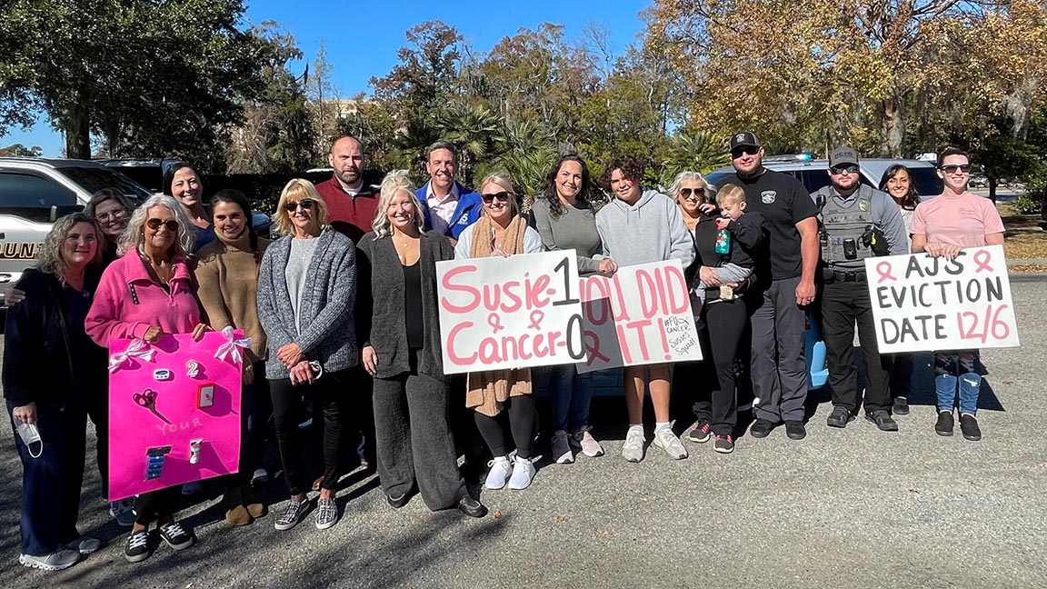 Friends and local celebrity Ed Piotrowski from WPDE ABC-15 gathered outside Tidelands Health Cancer Care Network at Murrells Inlet to surprise Susie Fisher following her final chemotherapy treatment for breast cancer.