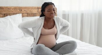 Expectant mother struggling with back pain