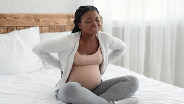 Expectant mother struggling with back pain