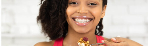 Woman eating granola