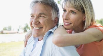 Middle-aged couple relaxing in park