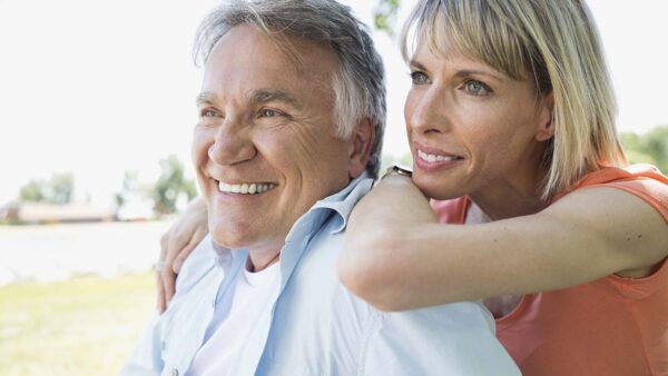 Middle-aged couple relaxing in park