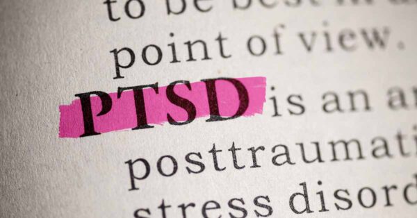 PTSD highlighted in pink in the text of a book