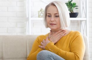 Woman struggling with GERD.