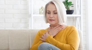 Woman struggling with GERD.