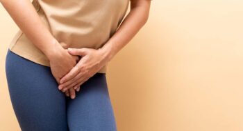 Woman struggling with need to urinate.