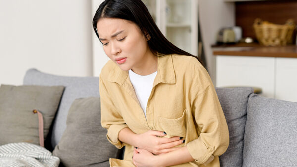 Woman struggling with stomach bug.