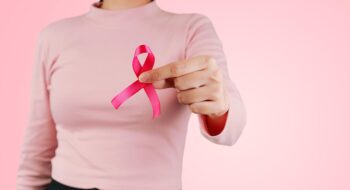 Woman with pink ribbon.