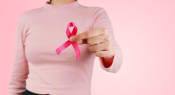 Woman with pink ribbon.