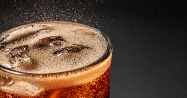 Cold carbonated liquid fresh and cool iced drink in a glass