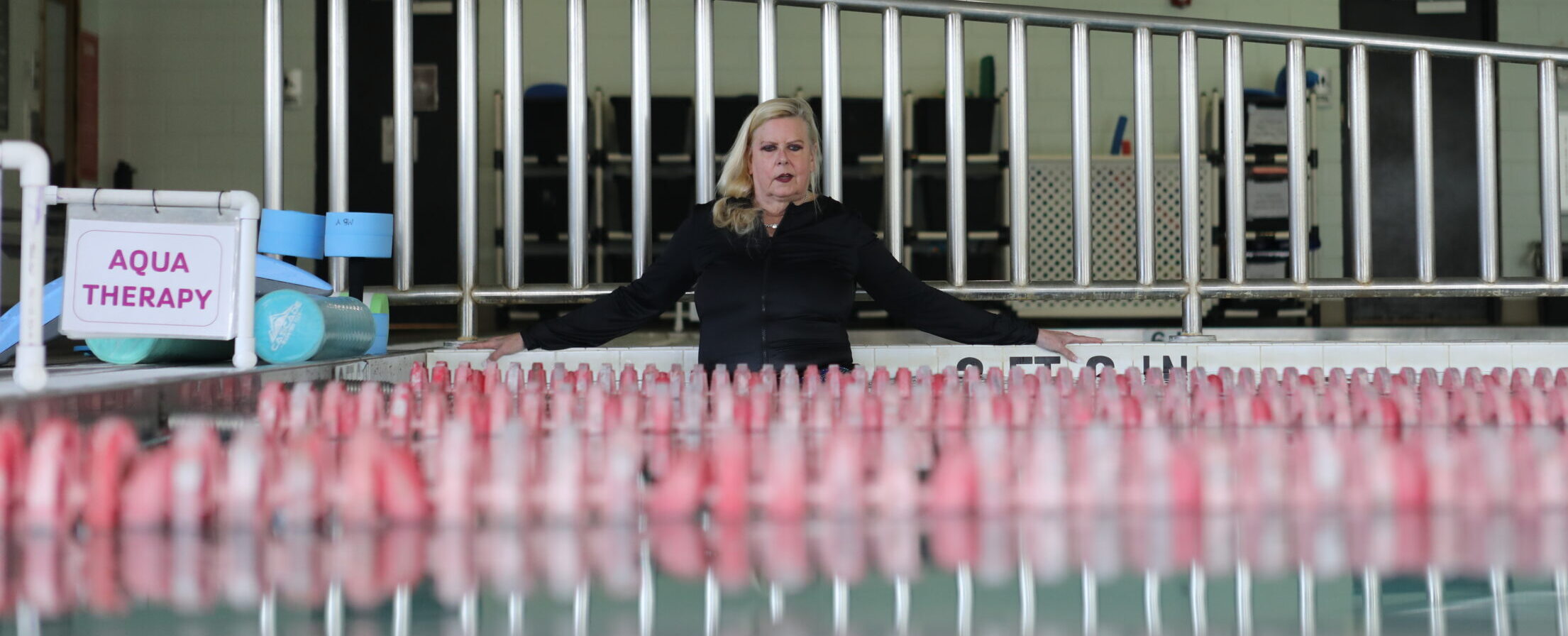 Susan Unice using the warm-water pool for aquatic therapy. 