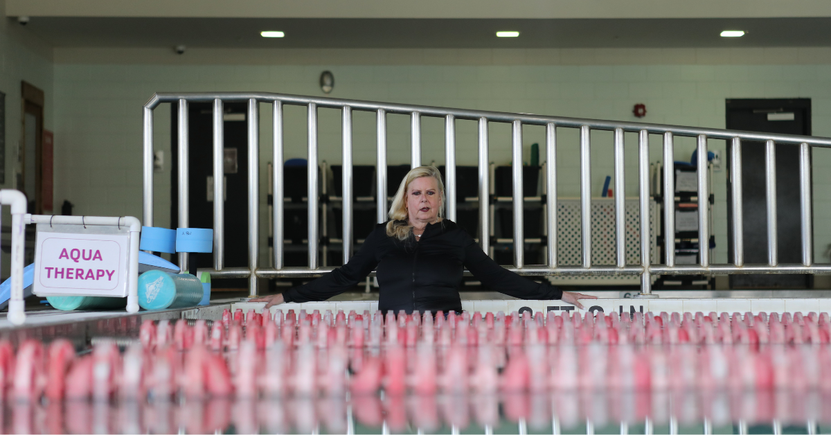 Susan Unice using the warm-water pool for aquatic therapy.