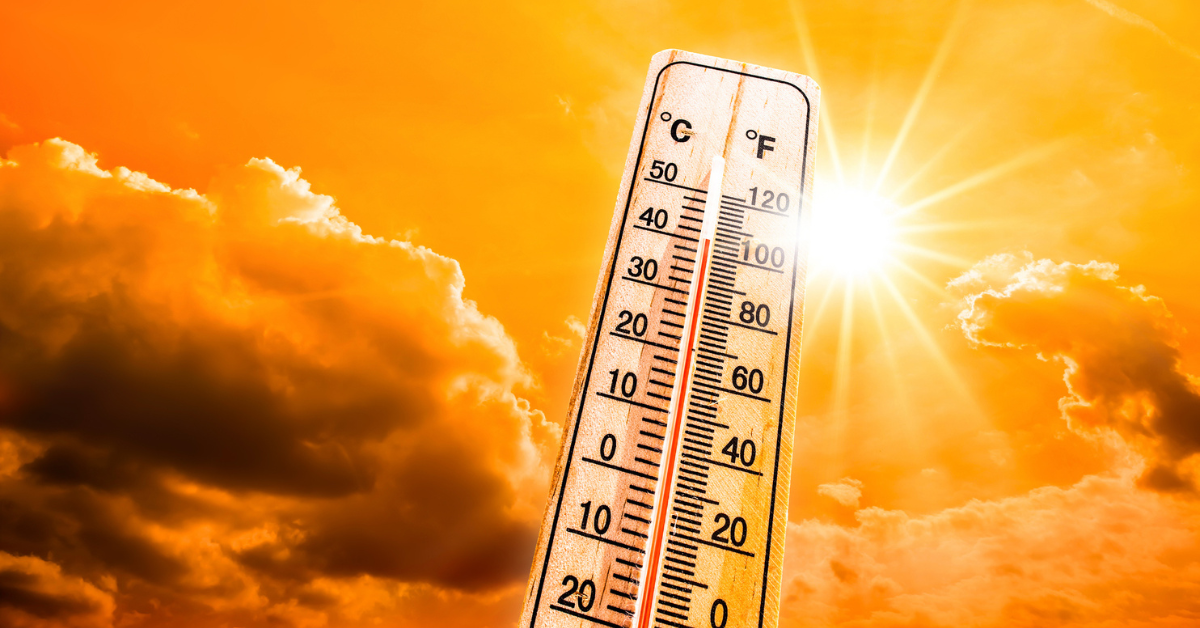 Hot summer or heat wave background, glowing sun on orange sky with thermometer