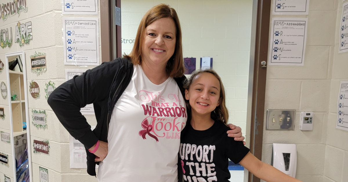 A teacher and student are wearing pajamas and smiling to raise money for Tidelands Health breast cancer fund.