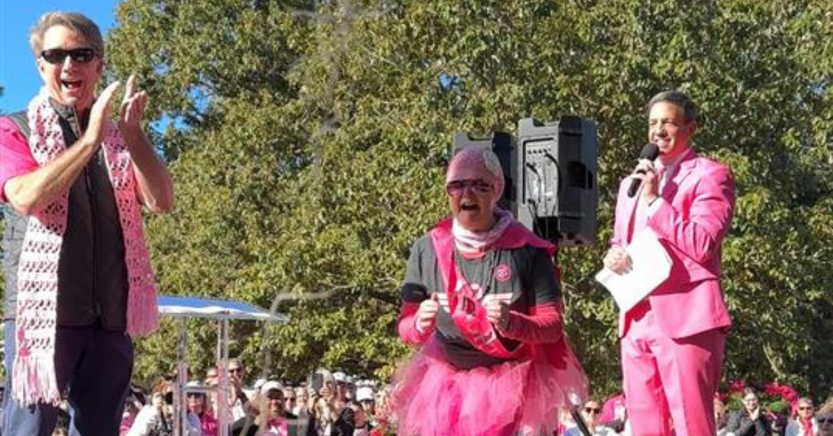 Dawn Konopka is surprised after seeing six of her friends at the In the Pink walk.
