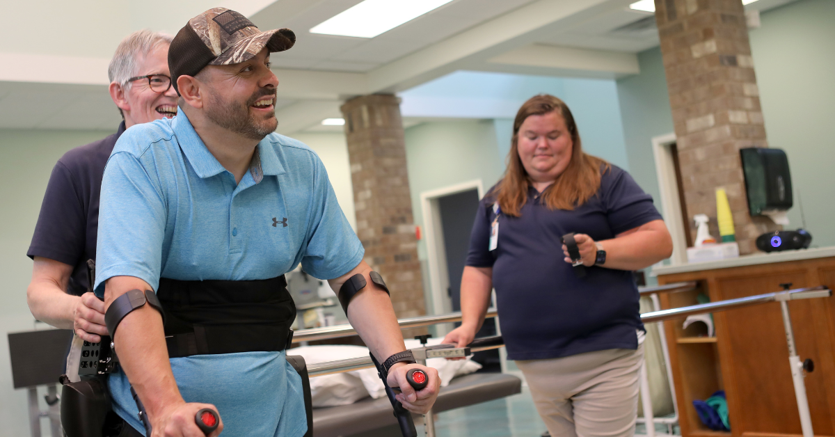 Matt Stewart beams with optimism as he learns to walk again using ReWalk exoskeleton.