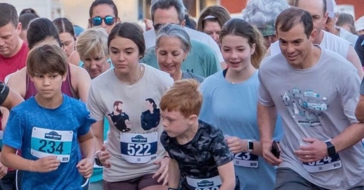 Dr. Alex Duvall and his family cross the start line at the annual Bridge2Bridge Run.