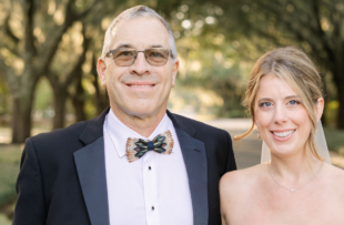 Bryan Workman and his daughter smile on her wedding day.